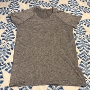 Gray Lululemon T-shirt never worn, but tags have been taken off